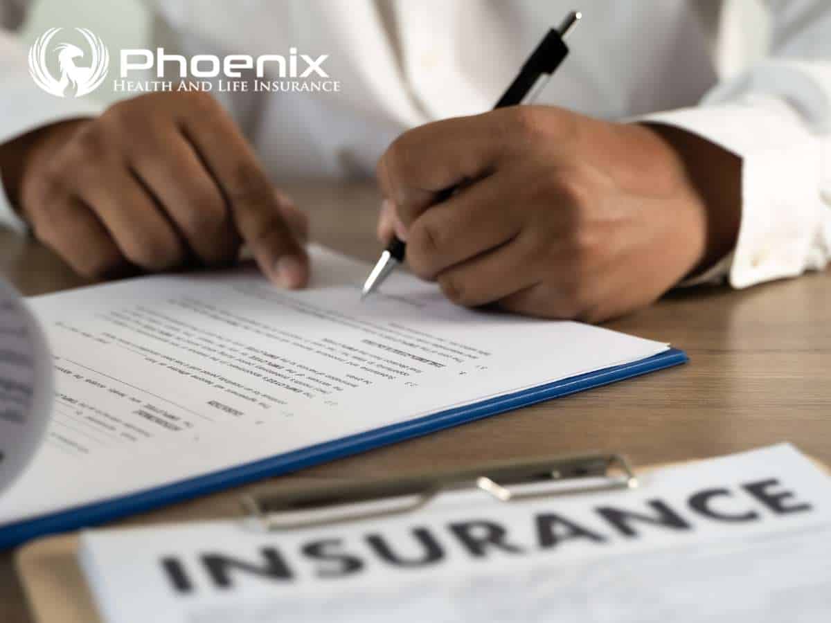 Person reviewing and signing travel insurance documents